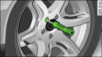 Changing a wheel: Hexagonal socket in screwdriver handle to turn the wheel bolts after they have been loosened
